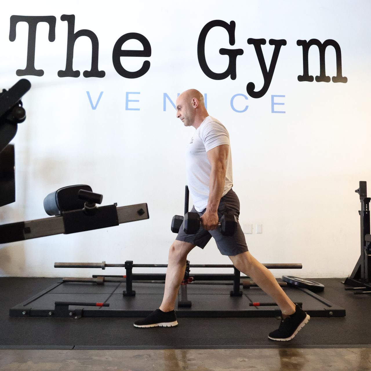 Man exercising in gym with kettlebell