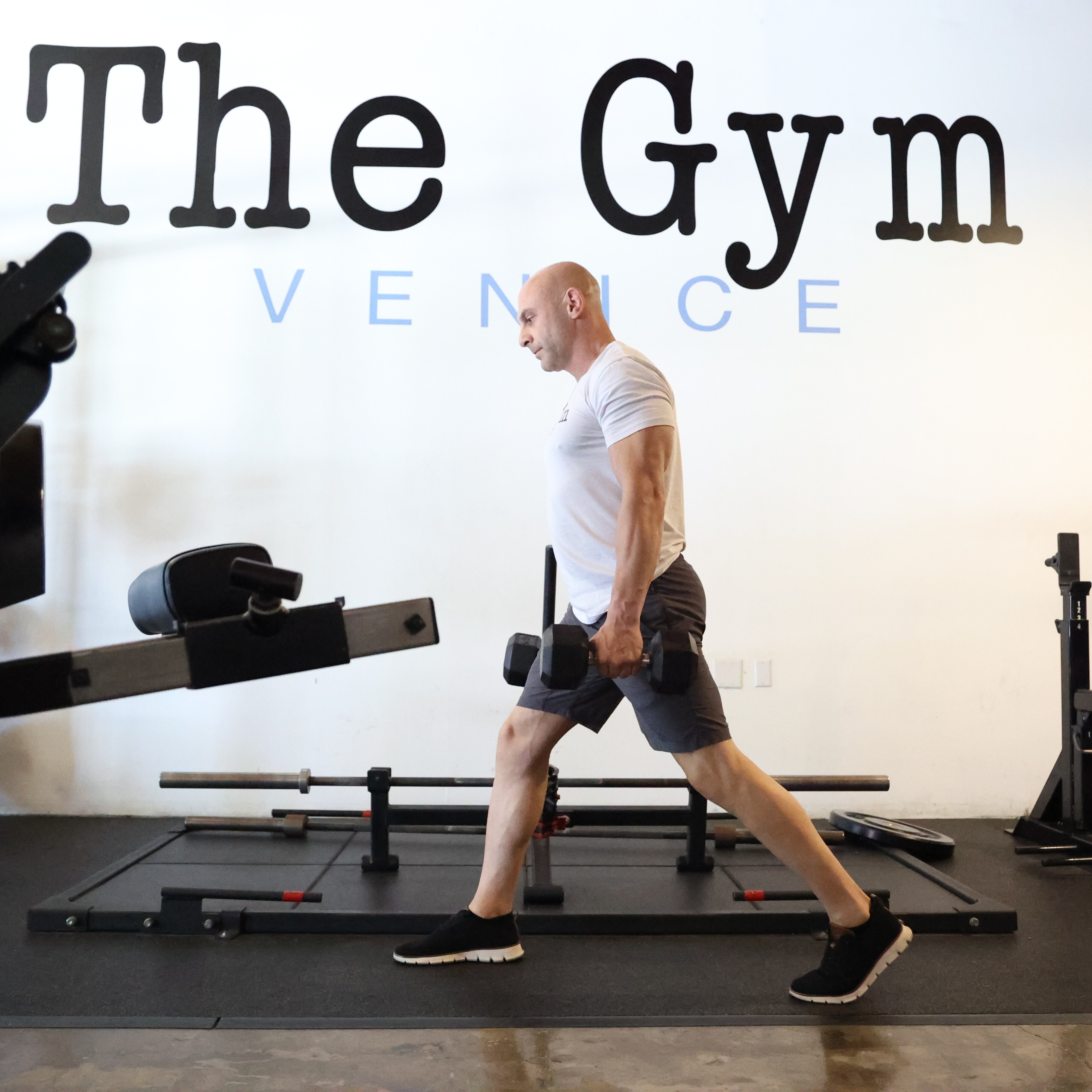 Man exercising in gym with kettlebell