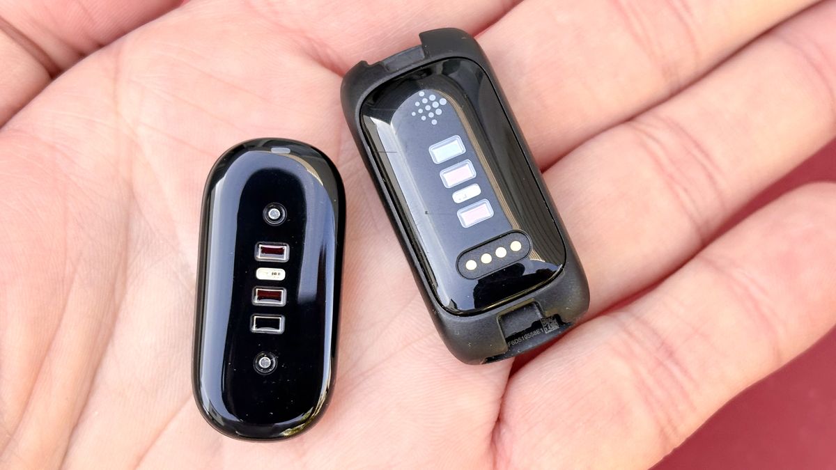 Close-up of the Fitbit Inspire 3 and Fitbit Air in a user's hand