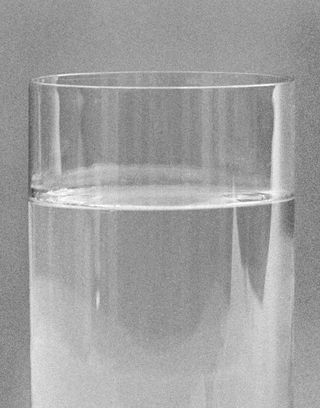 Grey image of a glass of water