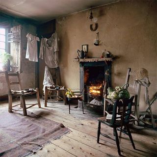 dennis severs house with wooden floor and chairs