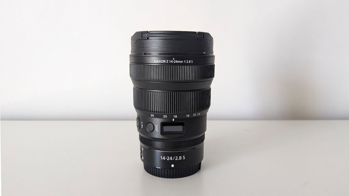 Nikon Z 14-24mm lens on a white table with a white backdrop