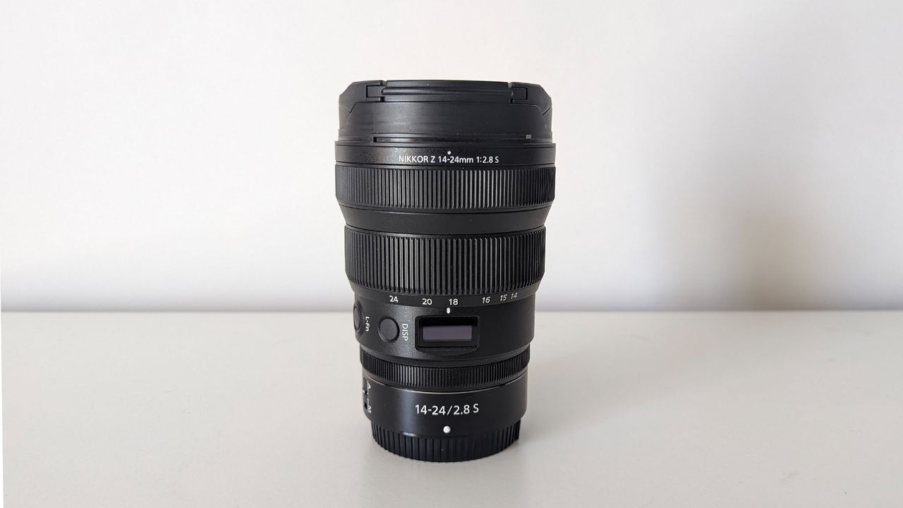 Nikon Z 14-24mm lens on a white table with a white backdrop