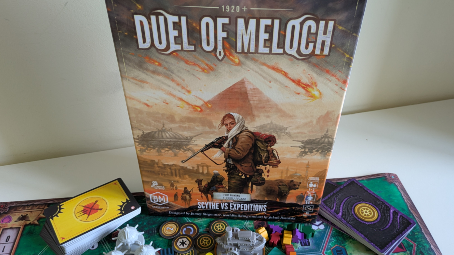 Duel of Meloch box, cards, and components on a plain background