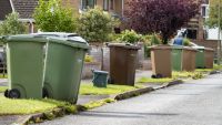 Wheelie bins kerbside for a number of homes