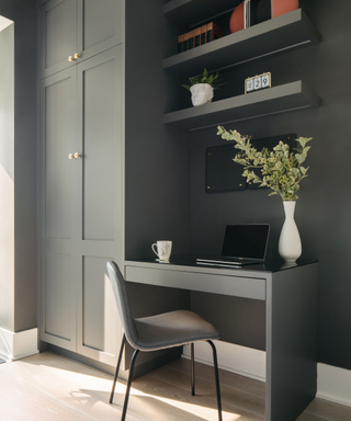 Green painted small desk cubby with open bespoke shelving