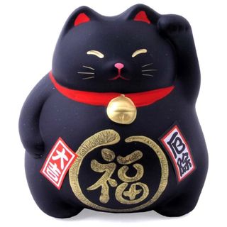 A black Maneki Neko with red collar and red and gold details