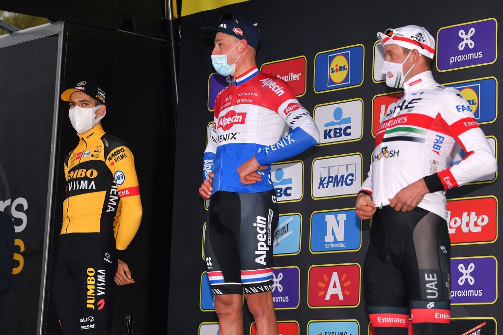OUDENAARDE BELGIUM OCTOBER 18 Podium Wout Van Aert of Belgium and Team Team Jumbo Visma Mathieu Van Der Poel of The Netherlands and Team AlpecinFenix Alexander Kristoff of Norway and UAE Team Emirates Celebration Mask Covid safety measures Hostess Miss during the 104th Tour of Flanders 2020 Ronde van Vlaanderen Men Elite a 2433km race from Antwerpen to Oudenaarde RVV20 FlandersClassic on October 18 2020 in Oudenaarde Belgium Photo by Luc ClaessenGetty Images
