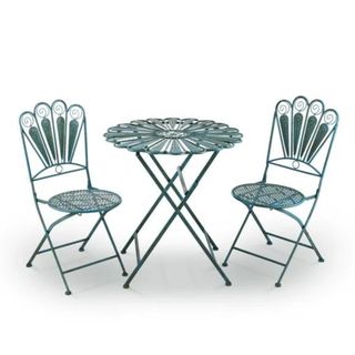 A blue bistro set with a table and two chairs, with a peacock feather design