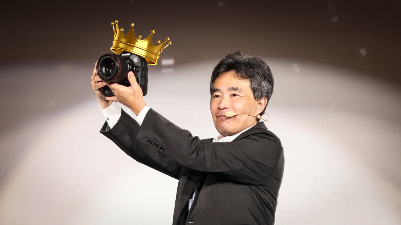 Canon executive Manabu Kato holds the Canon EOS R1 at the official product announcement