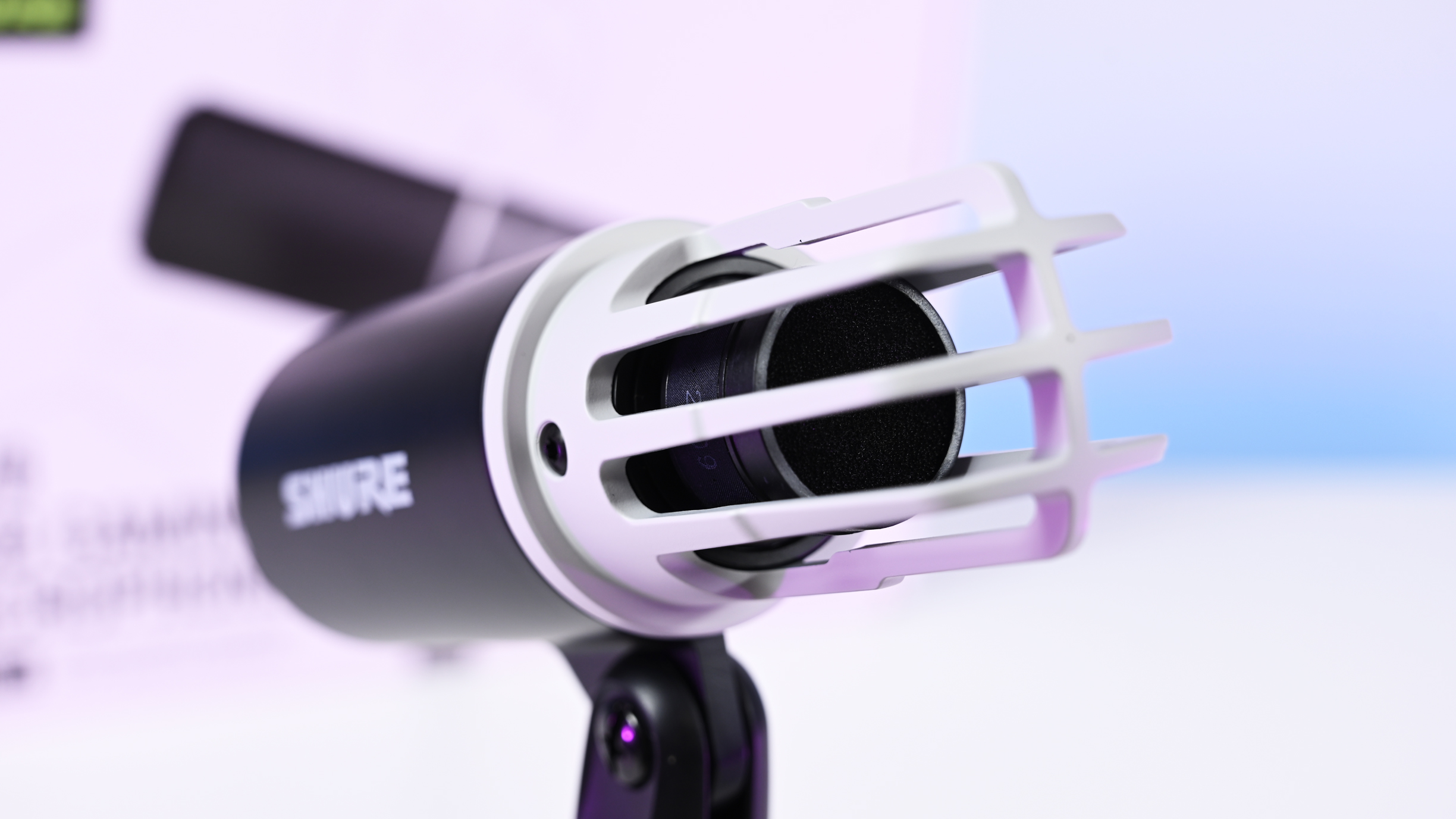 Close-up shot of the Shure MV6 Gen 2 microphone capsule with the foam windscreen off, showing the inner ribbed cage.