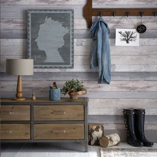 hallway with wood effect wallpaper and drawers