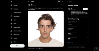 A screenshot of a post on X featuring a close-up, straight-on portrait photo of a man with dark, slightly messy hair and intense eyes, wearing a white t-shirt. The text above the photo reads: "the best portrait photographer in ny is the chinese passport photo lady on elizabeth lol".