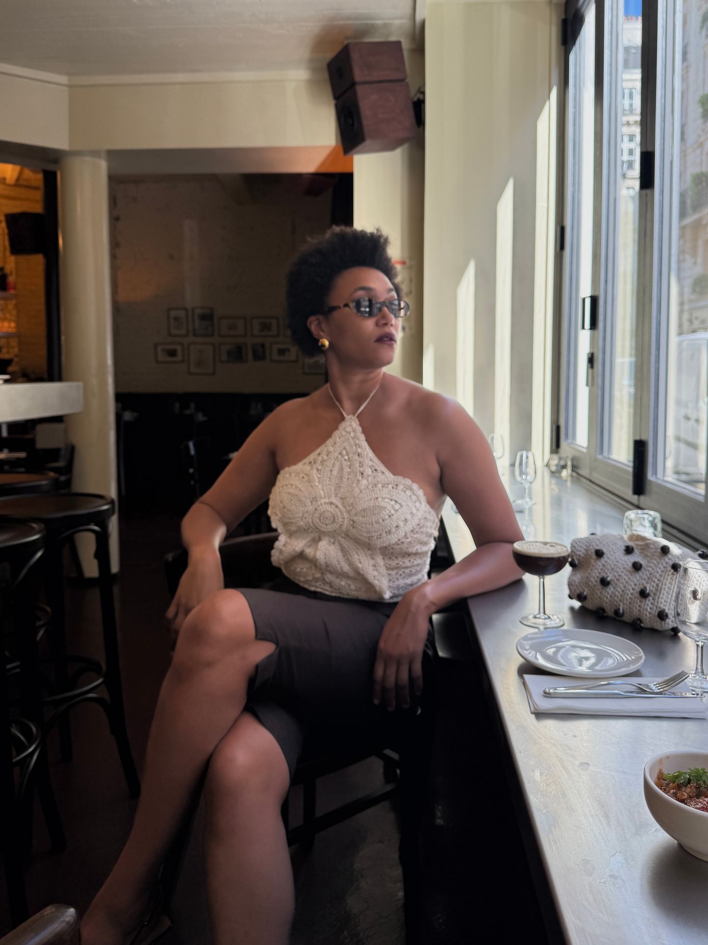 Influencer Léna Farouil wearing a crochet halterneck top.