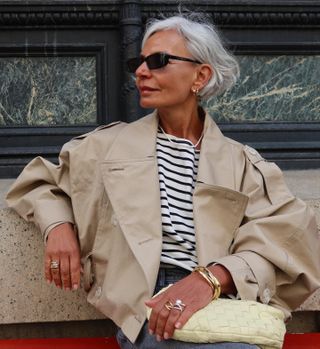 Woman outside in sunglasses.