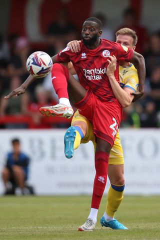 Faal battles with Crystal Palace defender Rob Holding during a pre-season clash