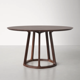 Modern wooden circular small space dining table from Wayfair.