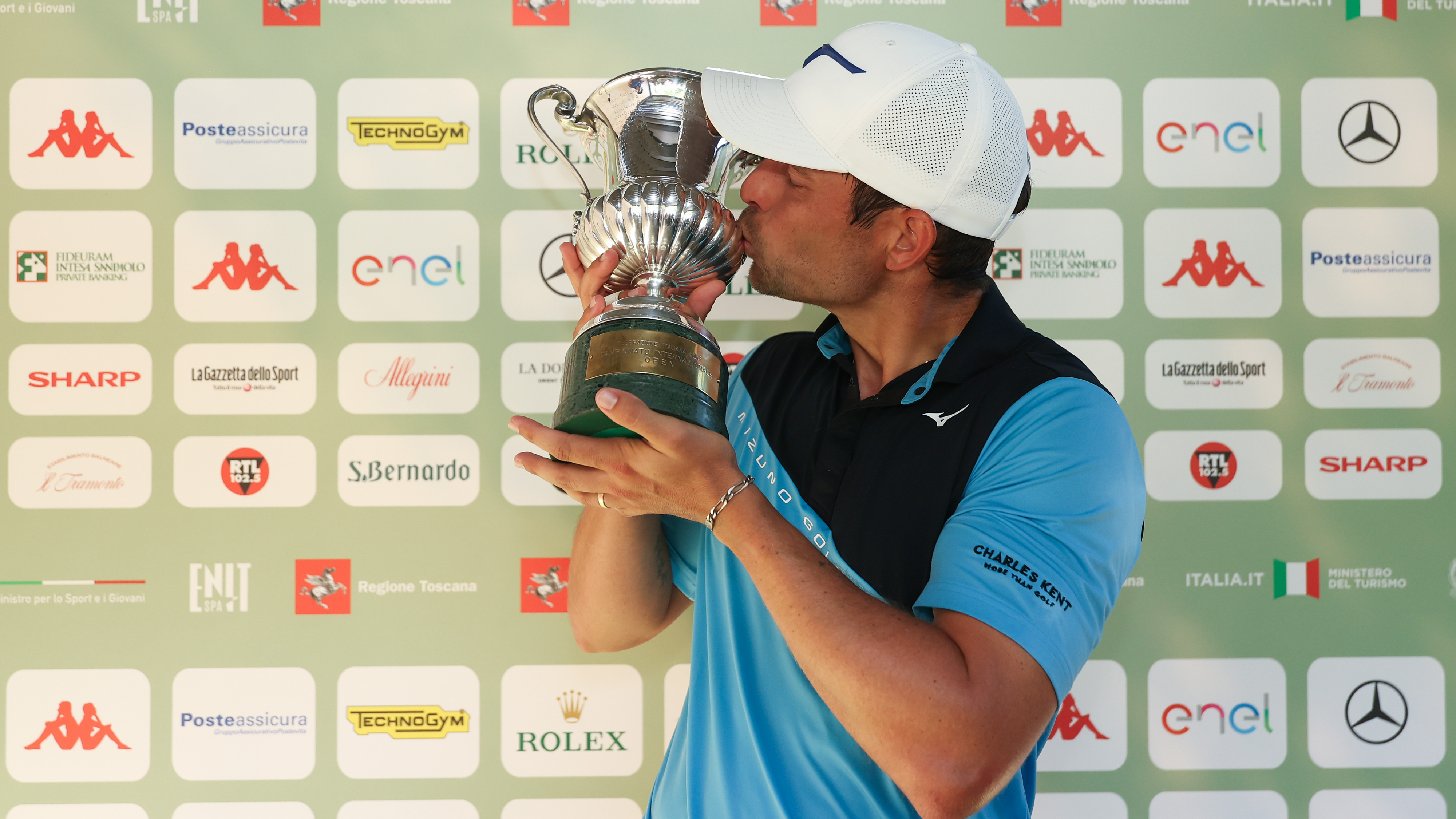 Adrien Saddier kissing the 2025 Italian Open trophy