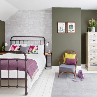 bedroom with olive green and white wall and paler wall paper