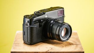 The Fujifilm X-Pro3 against a yellow background