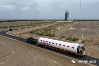 A stage of the Long March 2D arriving at Jiuquan Satellite Launch Center in the Gobi Desert.