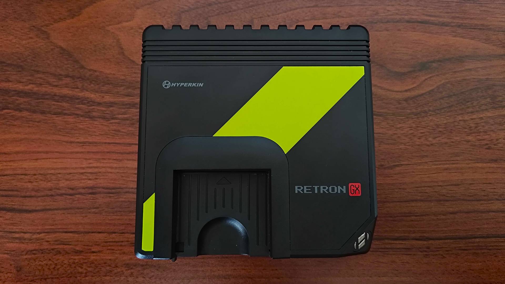 Top view of Hyperkin Retron GX on woodgrain desk.