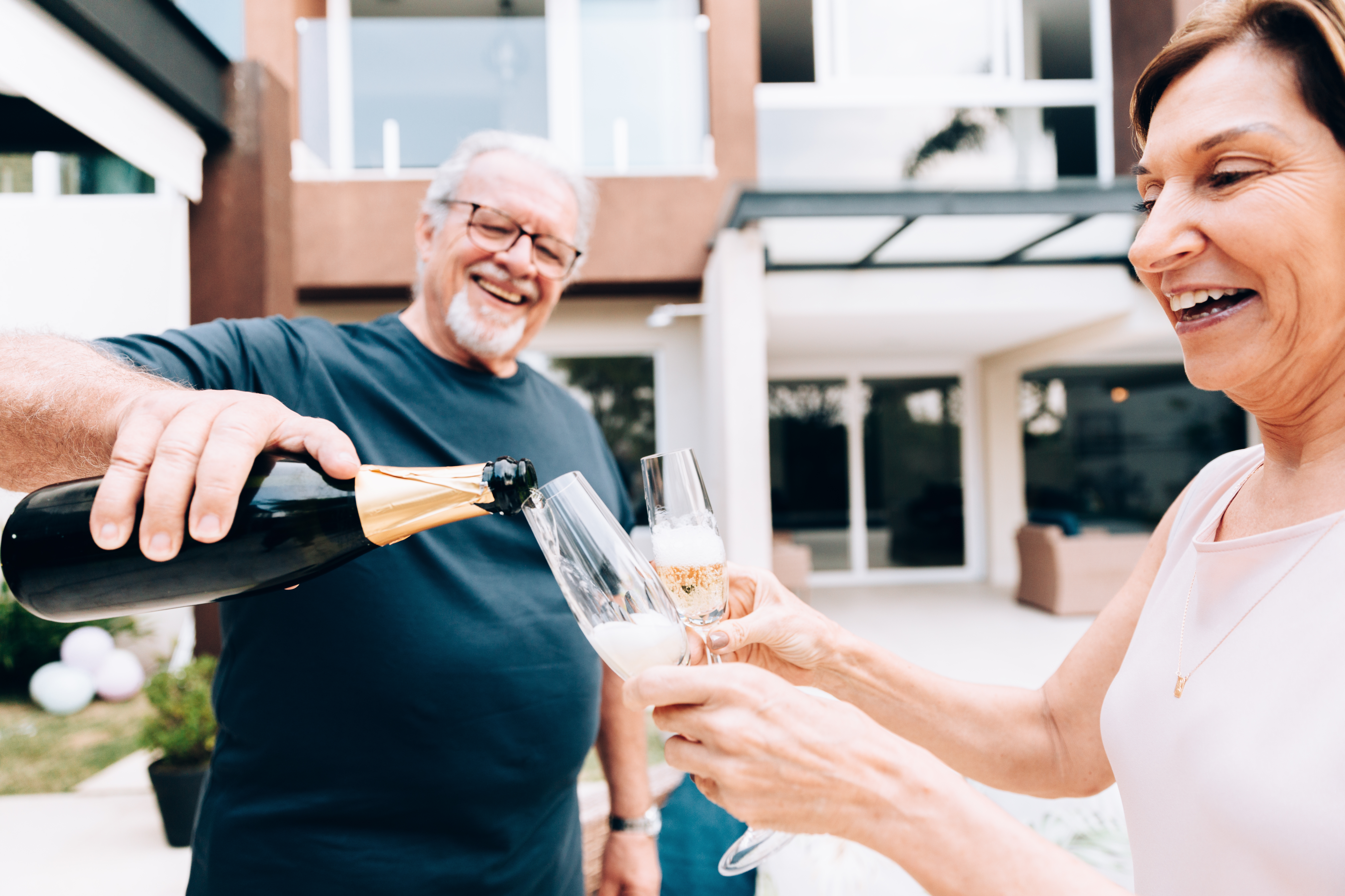 Premium Bonds holders look happy as they celebrate.