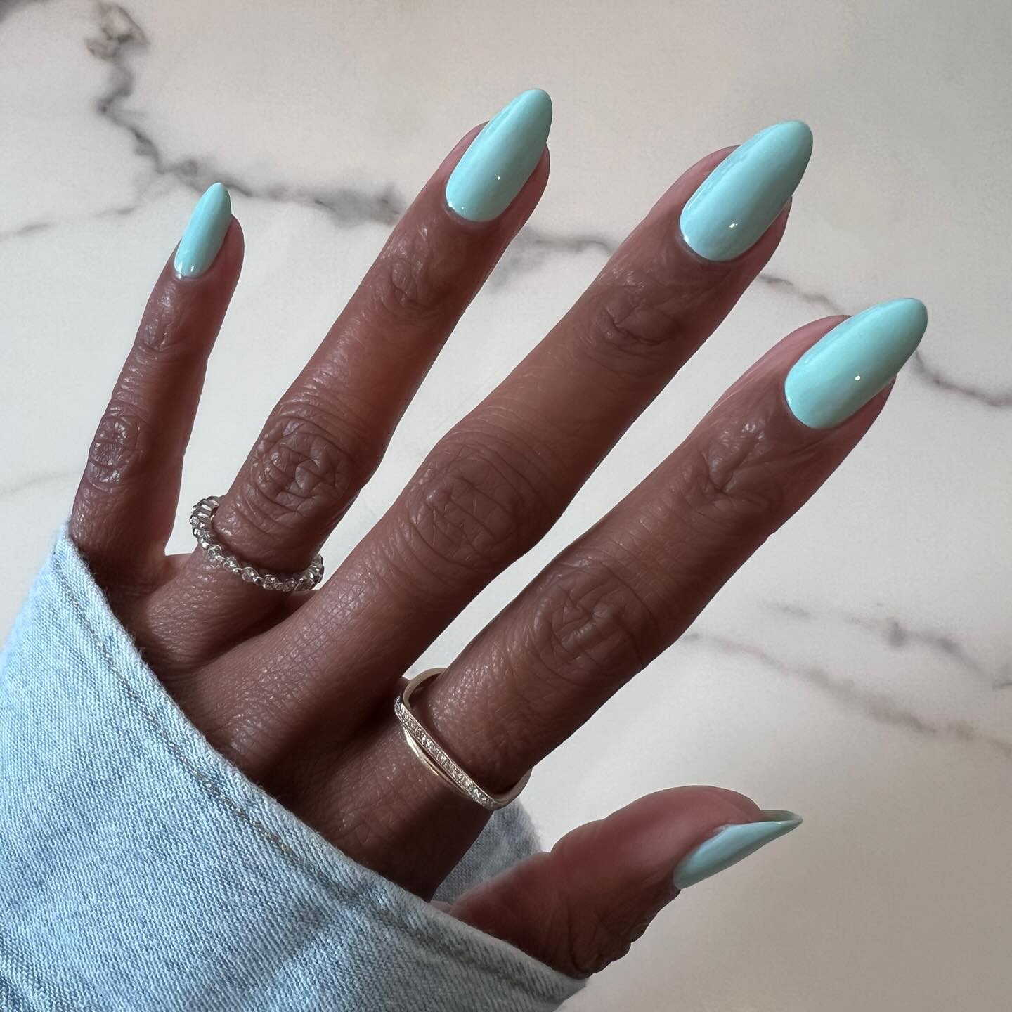 Turquoise nails.