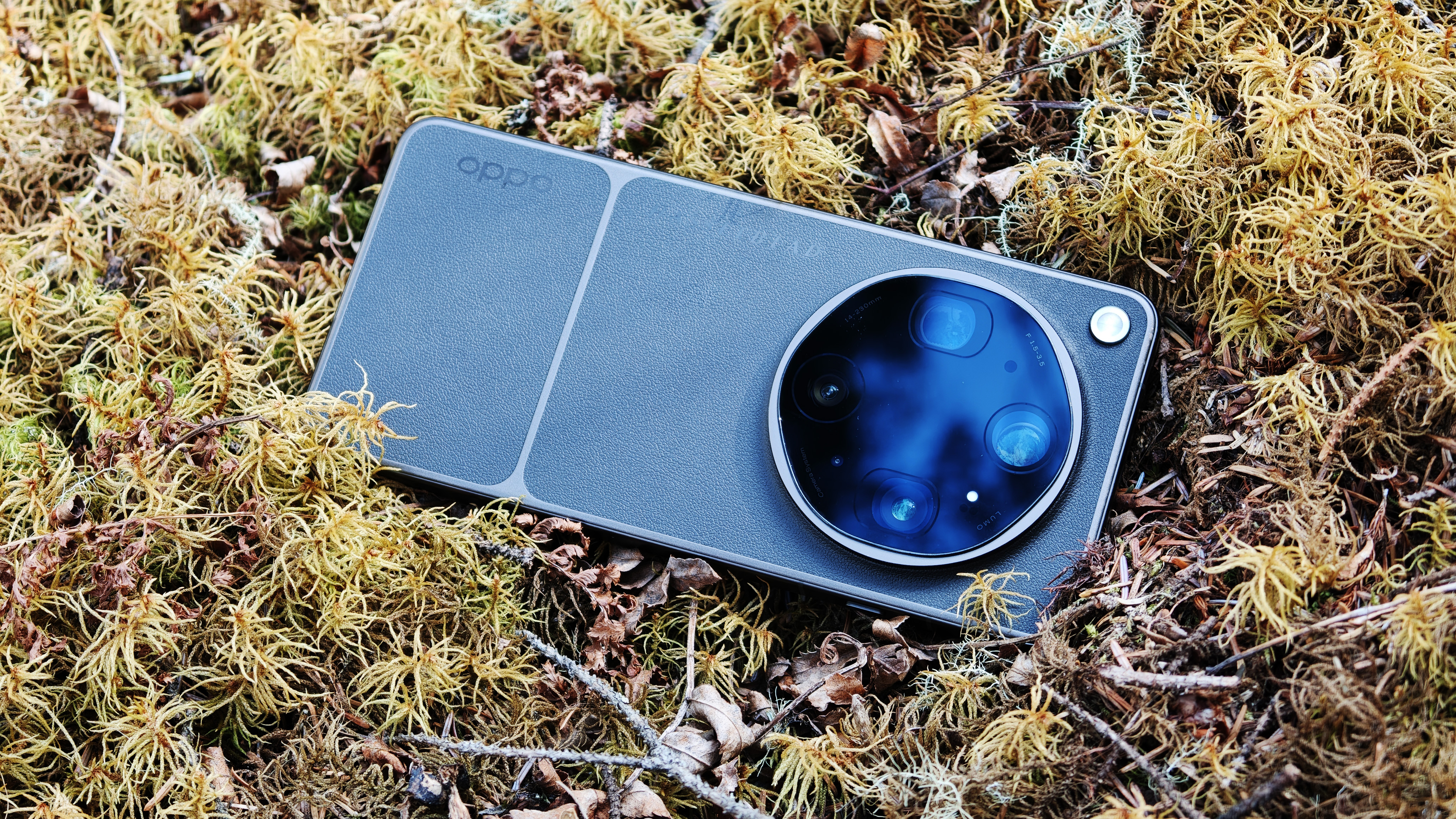 Oppo Find X9 Ultra phone on a mossy bed