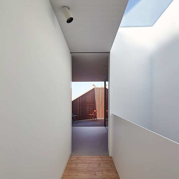 Building with home security camera and white walls