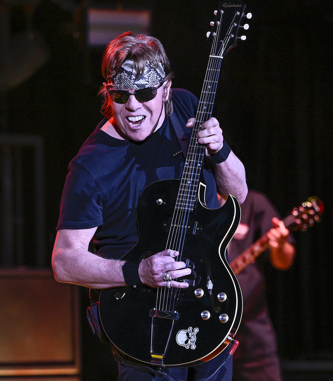 George Thorogood wields a black-finished Epiphone ES-125 onstage