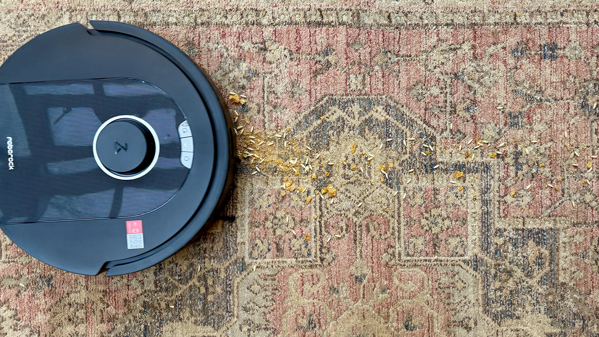 Flour and crumbs on carpet in front of Roborock Q5 Pro Plus