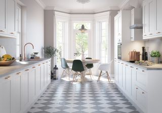 white galley kitchen with tiled flooring and large windows by magnet