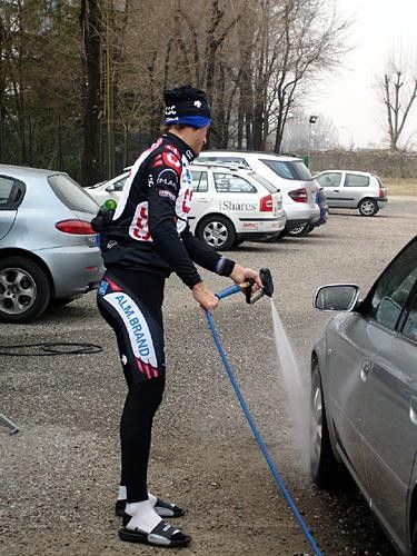 Fabian Cancellara taking advantage of the available tools to give his car a bit of a wash