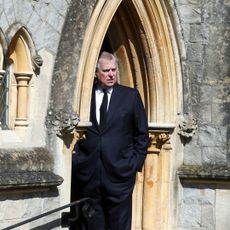 Prince Andrew standing in the doorway of the chapel at Royal Lodge