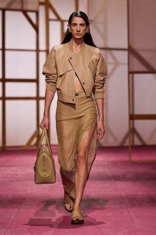 an Hermes model walks the spring/summer 2025 runway