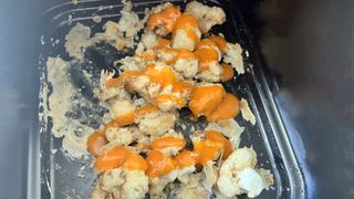 Cauliflower in air fryer coated with sauce