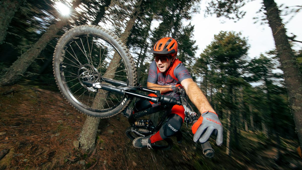 Mountain biker riding in the new Oakley 2023 MTB range