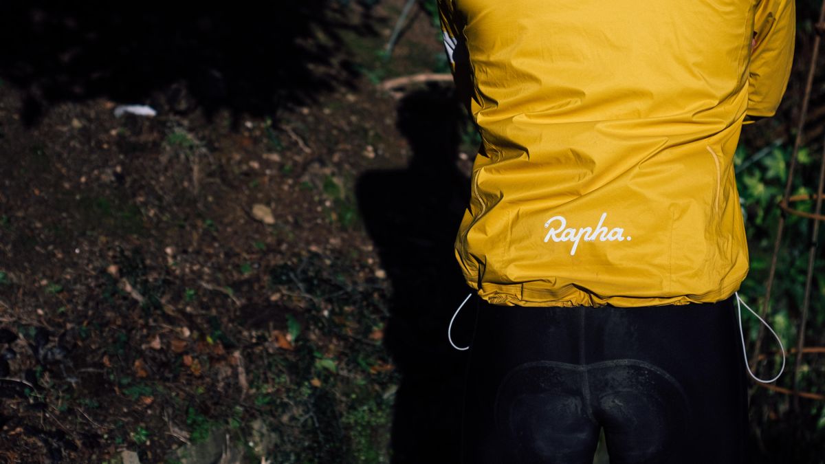 A yellow rapha core waterproof jacket