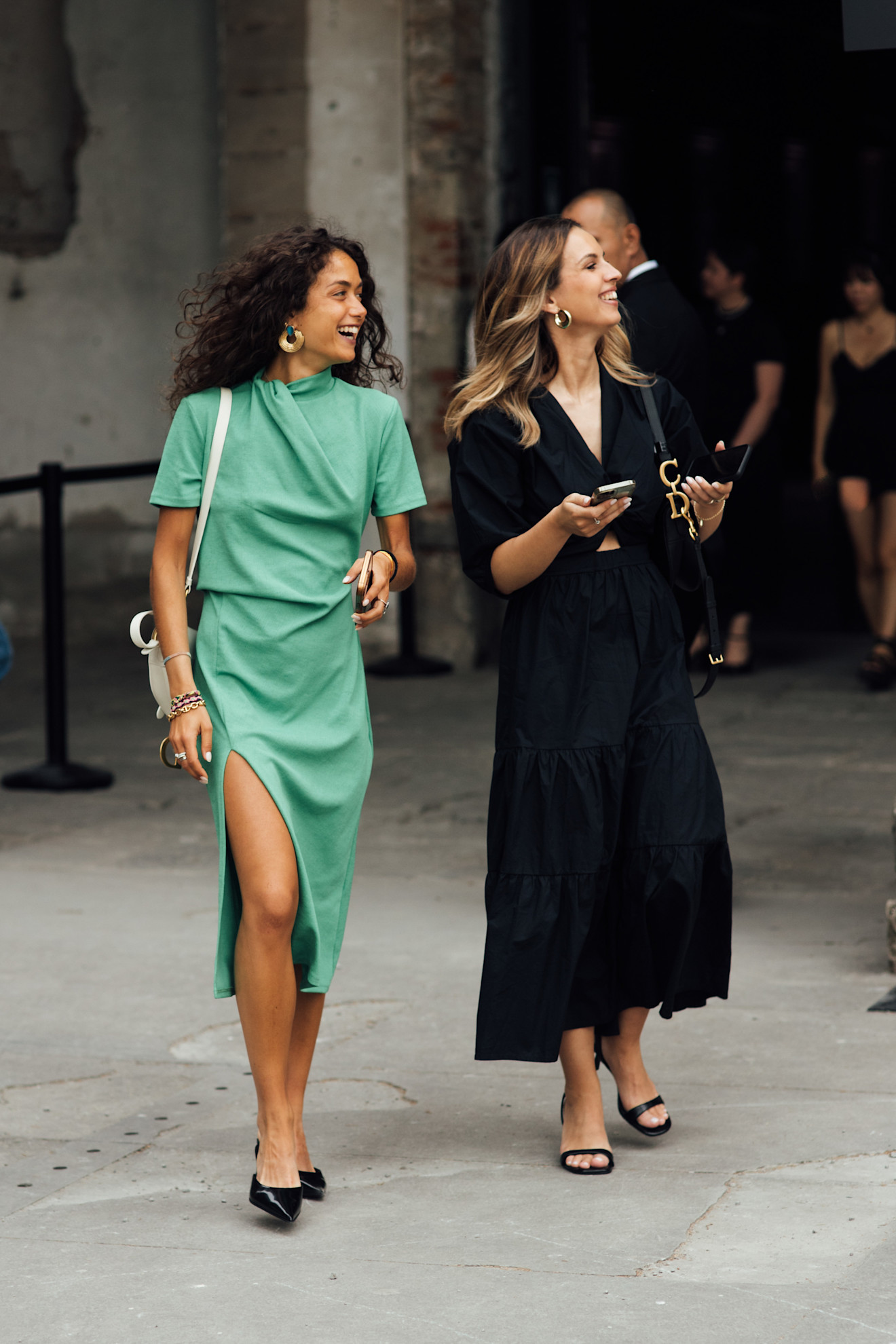 Milan Mens Fashion Week showgoer wears green in Milan.