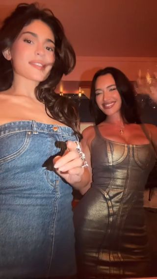 Kylie Jenner at a birthday party wearing a denim skirt as a mini dress