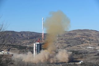 A Long March 4C rocket lifts off from Taiyuan carrying the Ziyuan-1 (02E) remote sensing satellite and a small passenger payload on Dec. 25, 2021