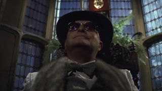 Truman Capote wearing sunglasses and a hat in Murder by Death