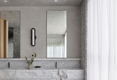 A bathroom with white curtains