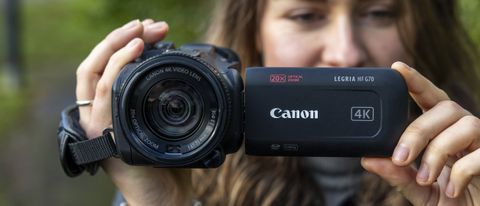 The Canon HF G70 being held by the reviewer, Lauren Scott