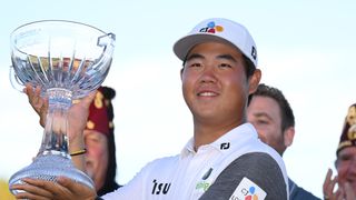 Tom Kim with the trophy after winning the 2022 Shriners Children's Open