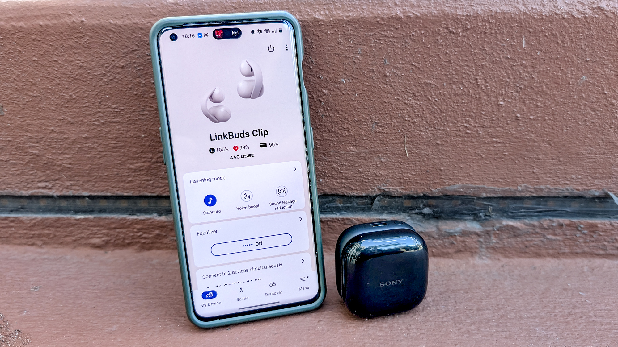 The Sony LinkBuds Clip in a Tom's Guide reviewer's hands and ears.