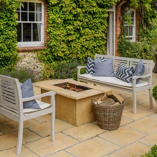 outdoor fireplace brick walls and tiled flooring