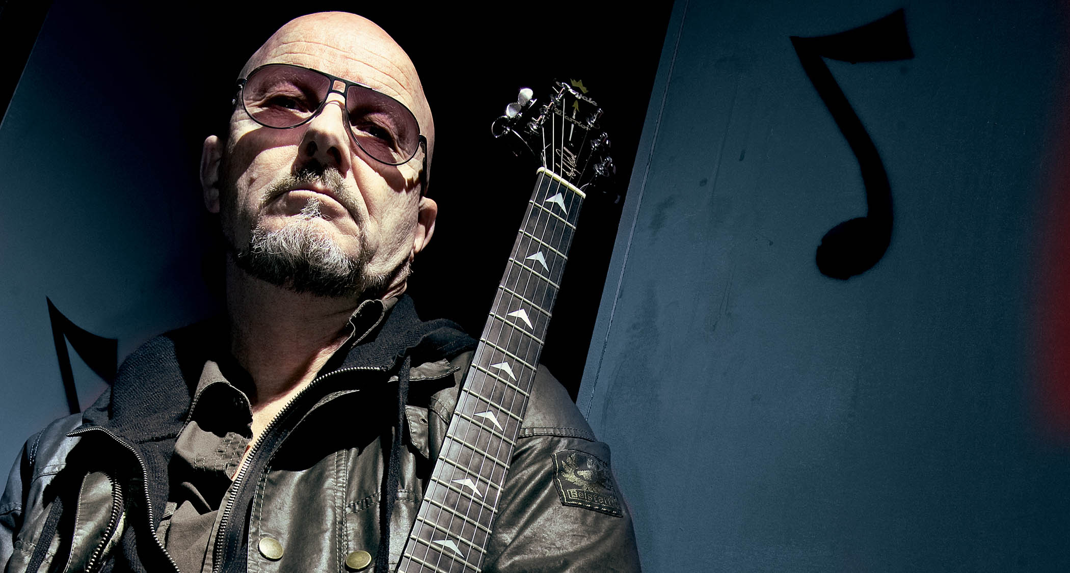 Andy Powell of Wishbone Ash photographed with a V.