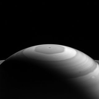 Saturn's strange hexagon-shaped vortex and bands of swirling clouds are captured in this stunning new photo from NASA's Cassini spacecraft.